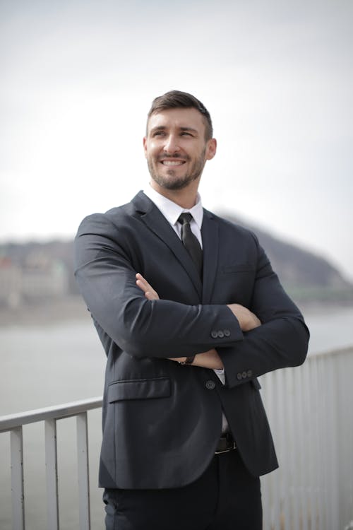 Secretary Portrait Free Image Free Man in Black Suit Jacket Standing Near Railings Stock Photo